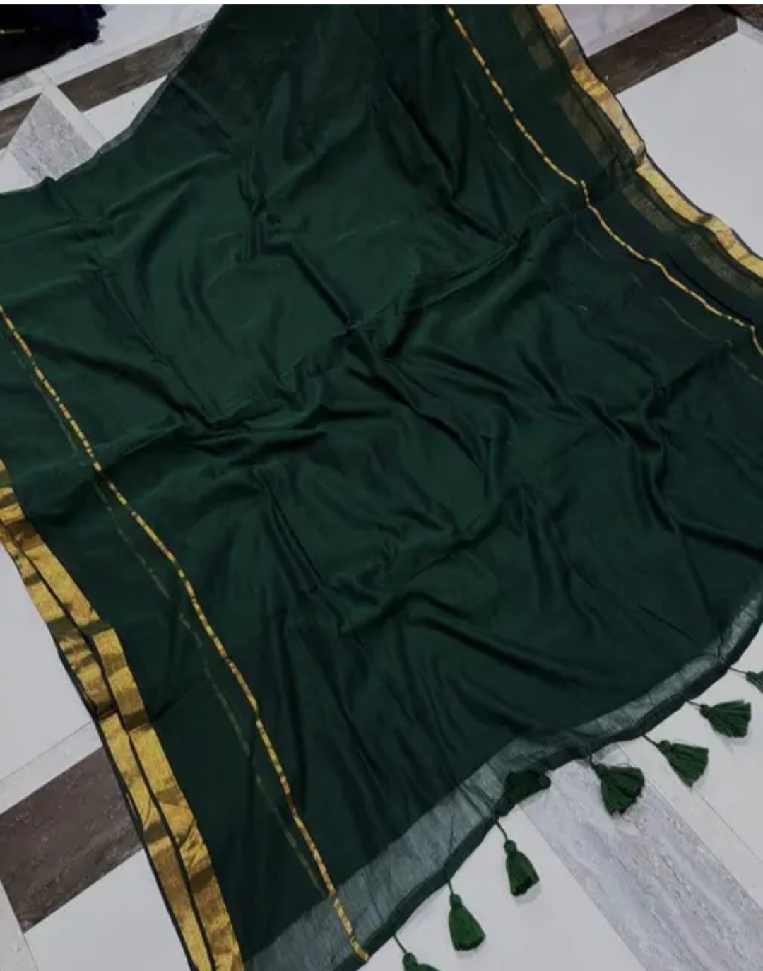 Bottle green mul cotton saree with zari border