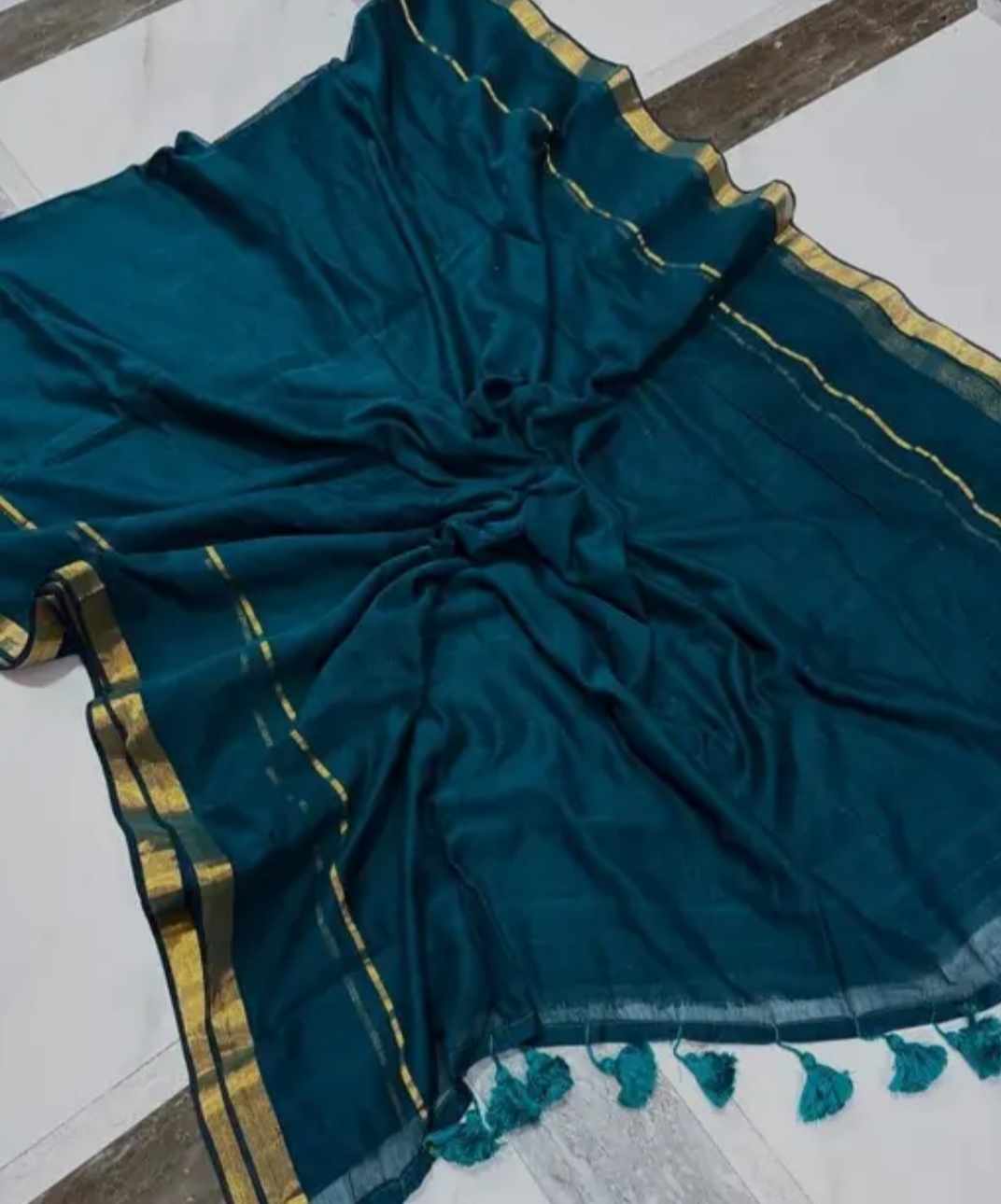 Teal colour mul cotton saree with zari border